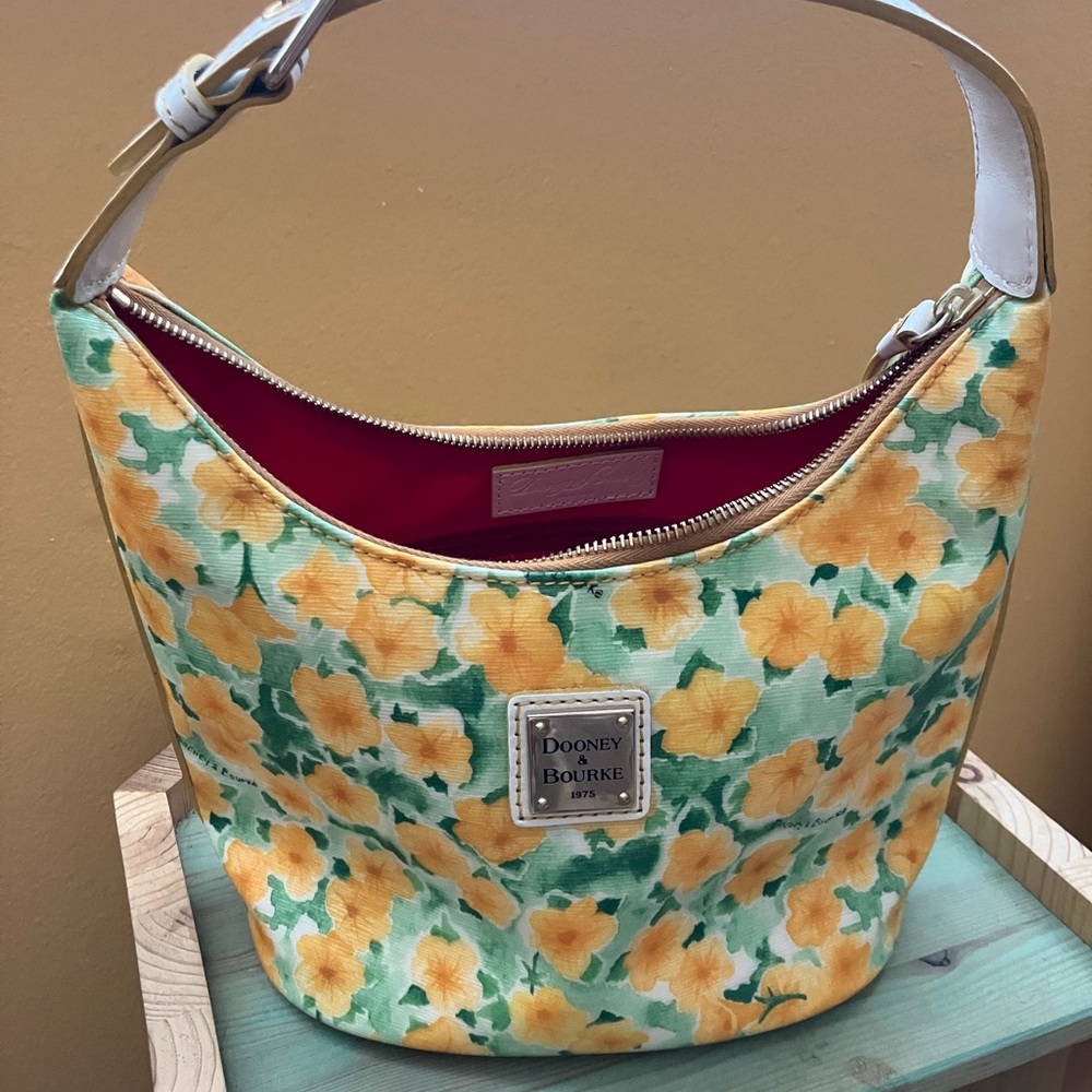 Dooney and Bourke yellow and white Petunia floral bucket bag